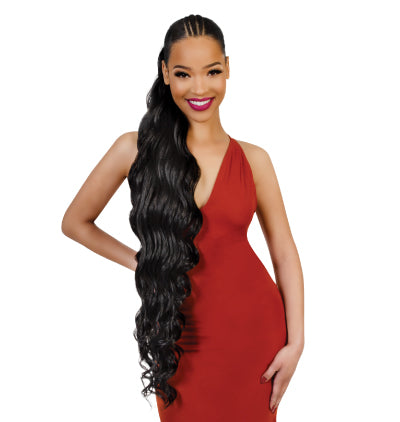 Woman in a red dress with long, Carli 40 inch ponytail on a white background