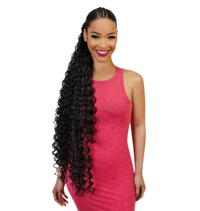 Woman with styled ponytail in a pink dress on a white background