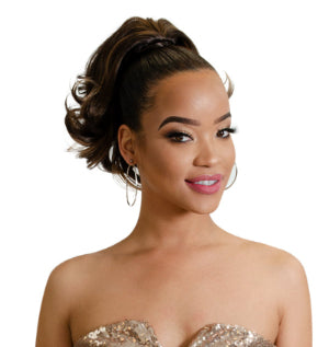 Woman wearing a synthetic drawstring ponytail with sparkly strapless dress on a white background