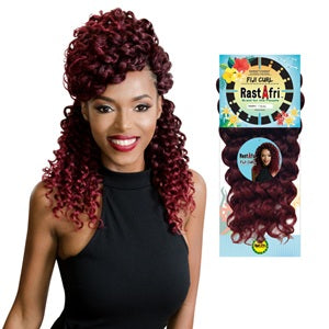 Woman with styled hair and RastAfri fuji curl packaging in the background