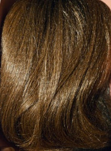 Close-up of brown hair with a blurred background