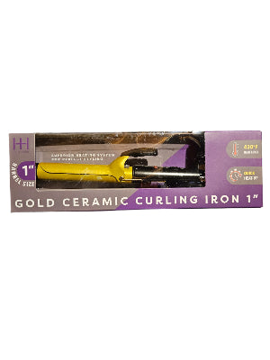 Gold ceramic curling iron packaging held by a person with a blurred background
