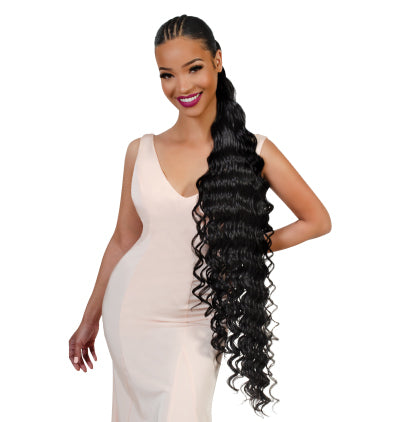 Woman with long, styled Rosie ponytail extensions on a white background