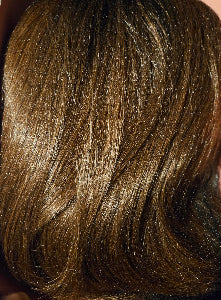 Close-up of brown hair with highlights