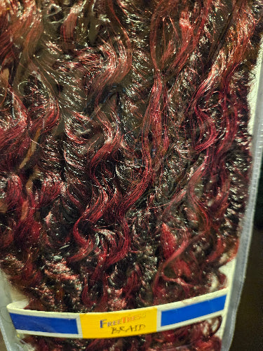 Close-up of boho hippie crochet locs  with a brand label in the corner.