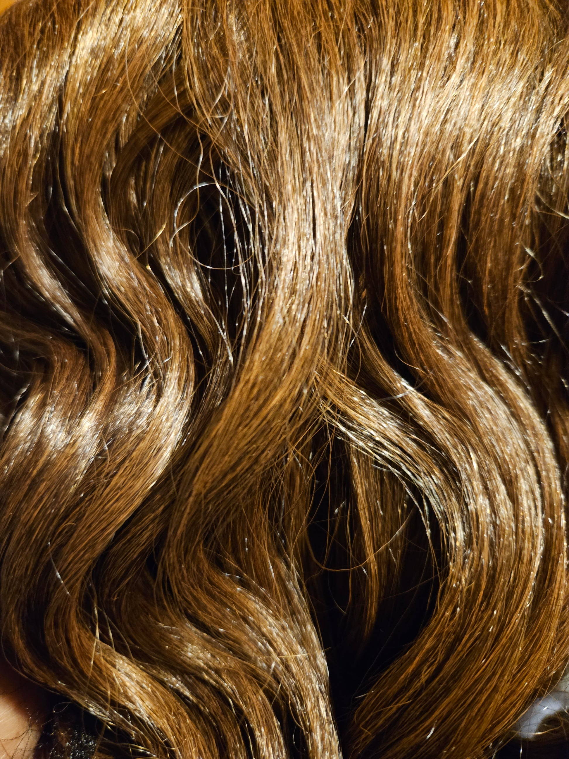Close-up of wavy brown hair