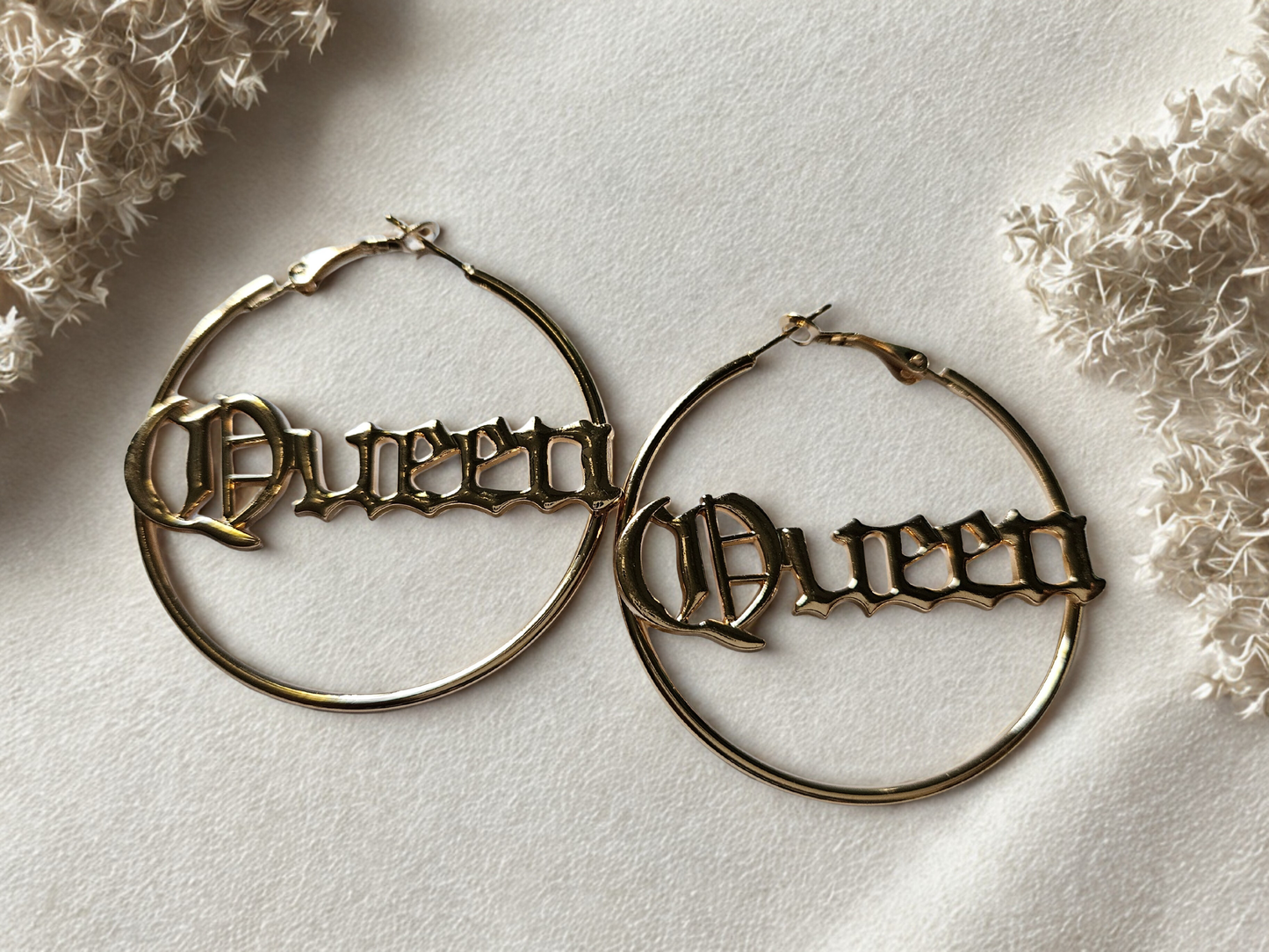 Queen hoop earrings. Gold tone hoops. 
