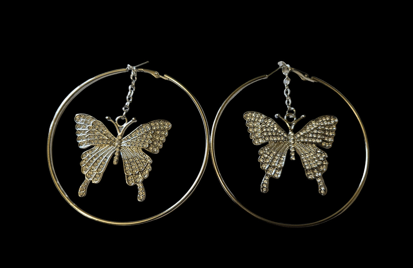 Hoop earrings in silvertone with rhinestone butterfly 