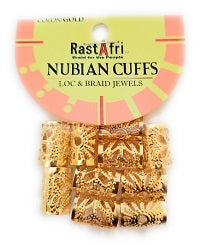 Pack of gold-toned Nubian cuffs with a yellow and pink header card labeled 'Rast Afri NUBIAN CUFFS LOC & BRAID JEWELS'.