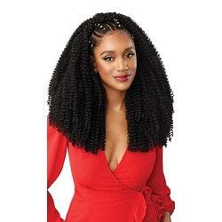 Woman in a red dress with styled hair on a white background