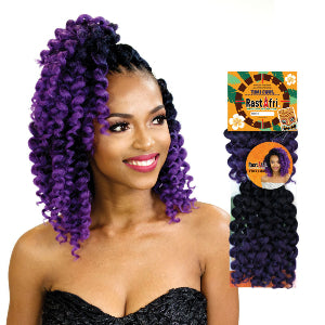 Woman with purple hair styled in twists, next to a Rastafari product package.